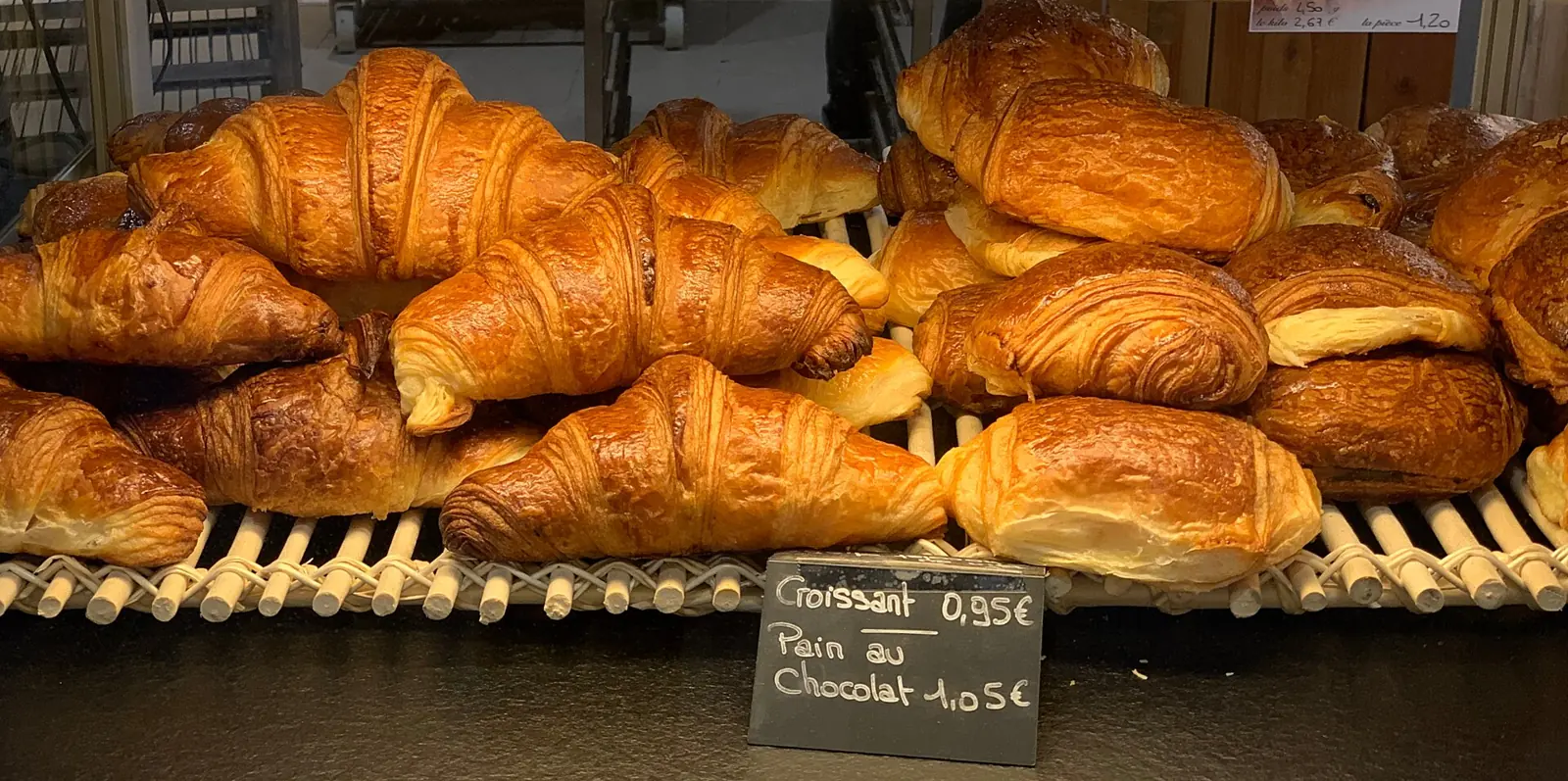 Croissants and pains au chocolat in the pastry case